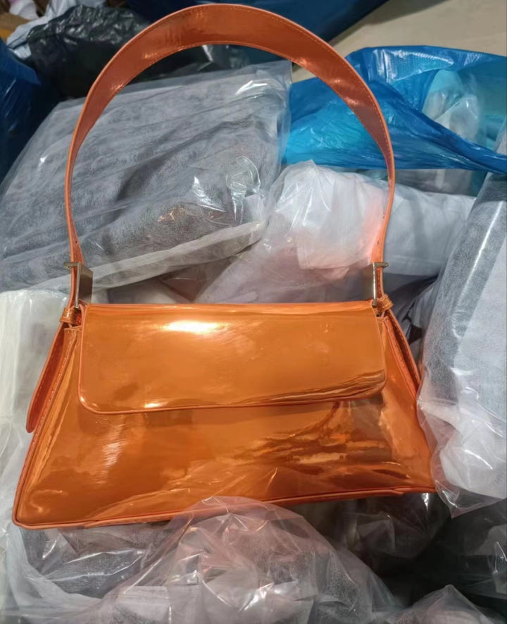 Autumn New All-match Shoulder bag in caramel color with a soft PU material and clamshell design.
