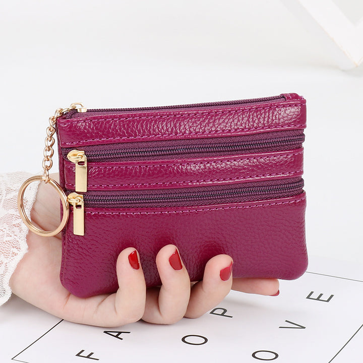 Women's Coin Purse Short and I in purple with multiple zippered pockets, held in hand.